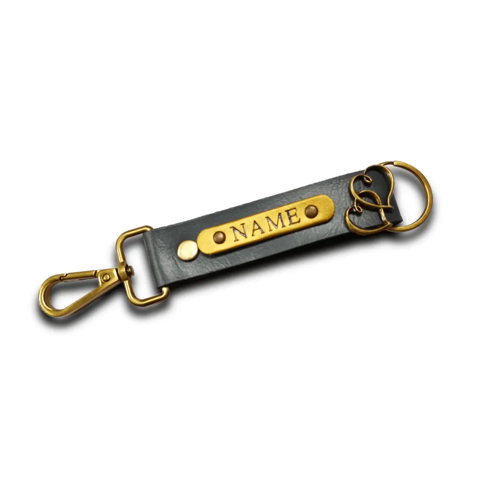 Customized Grey Keychain with Name & Heart Charm | CUG Customized grey keychain with name badge and heart charm by CUG